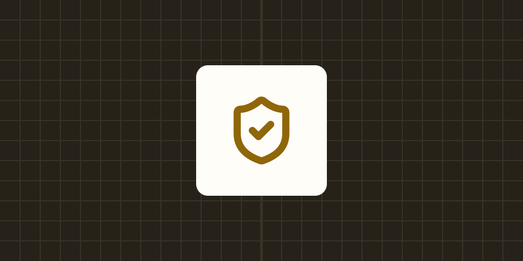 A shield with a check mark on a cream plate over a dark graph-paper field